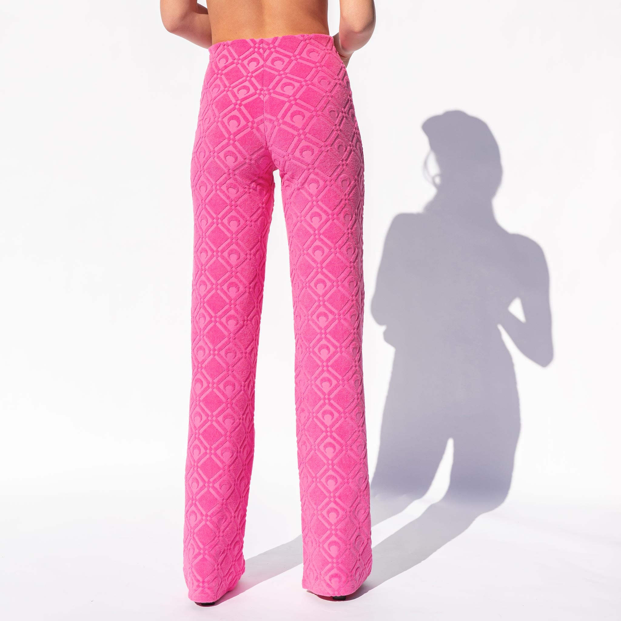 Back half body photo of model wearing the Moon Sponge Jacquard Lounge Pants - Fuchsia.