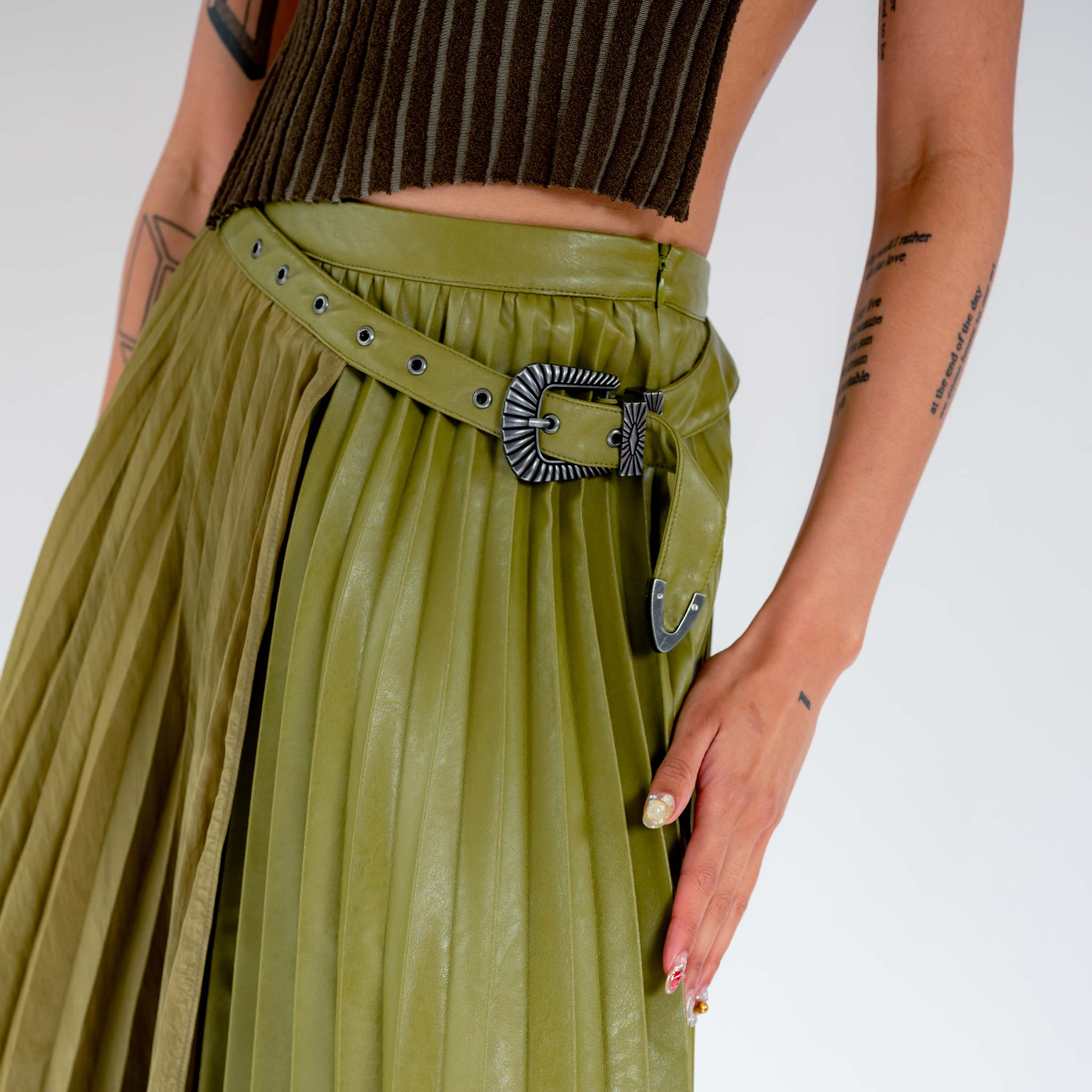 Close detail photo of model wearing the Nicola Double Pleat Skirt - Khaki.
