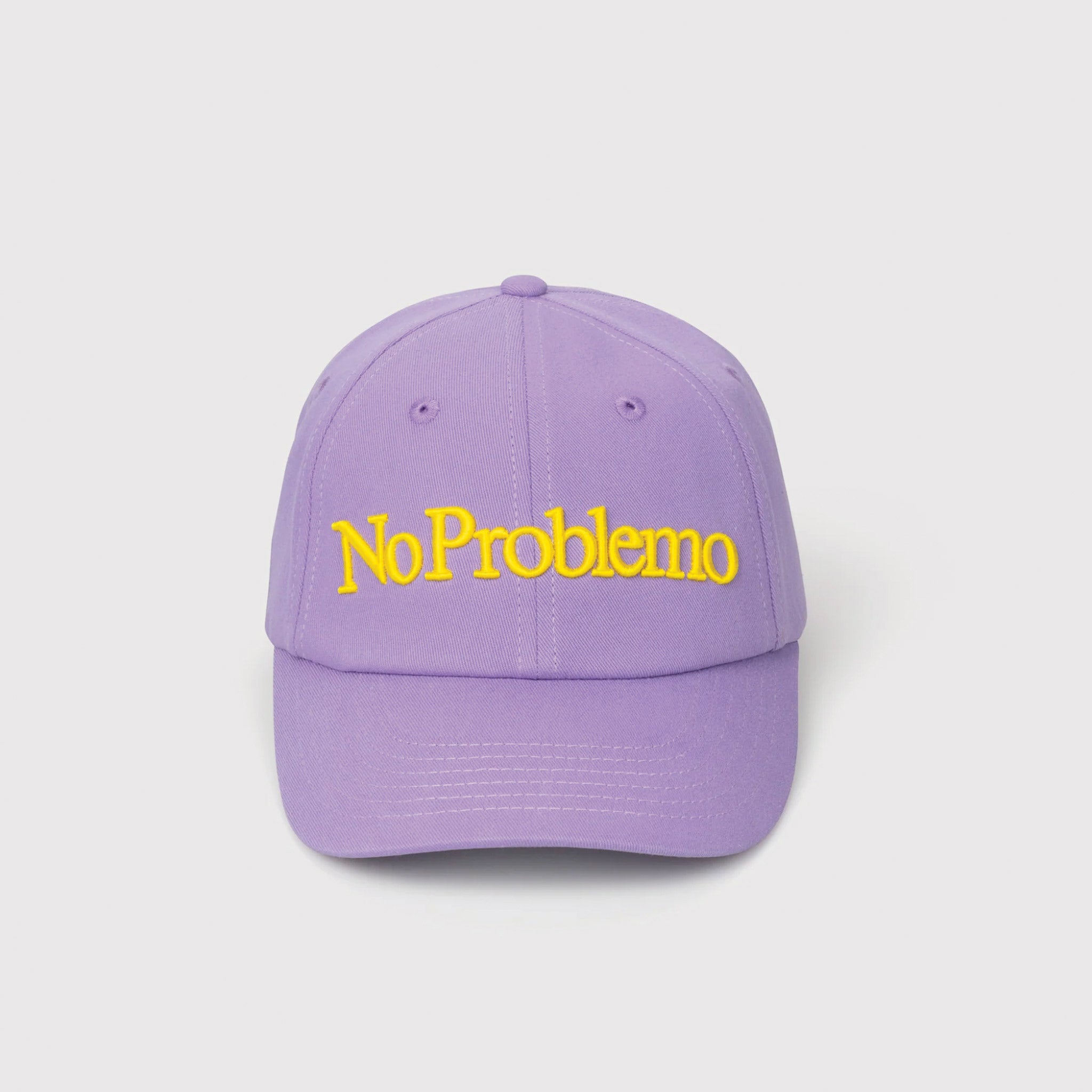 Flat detail photo of the No Problemo Cap in lilac purple with yellow embroidery.