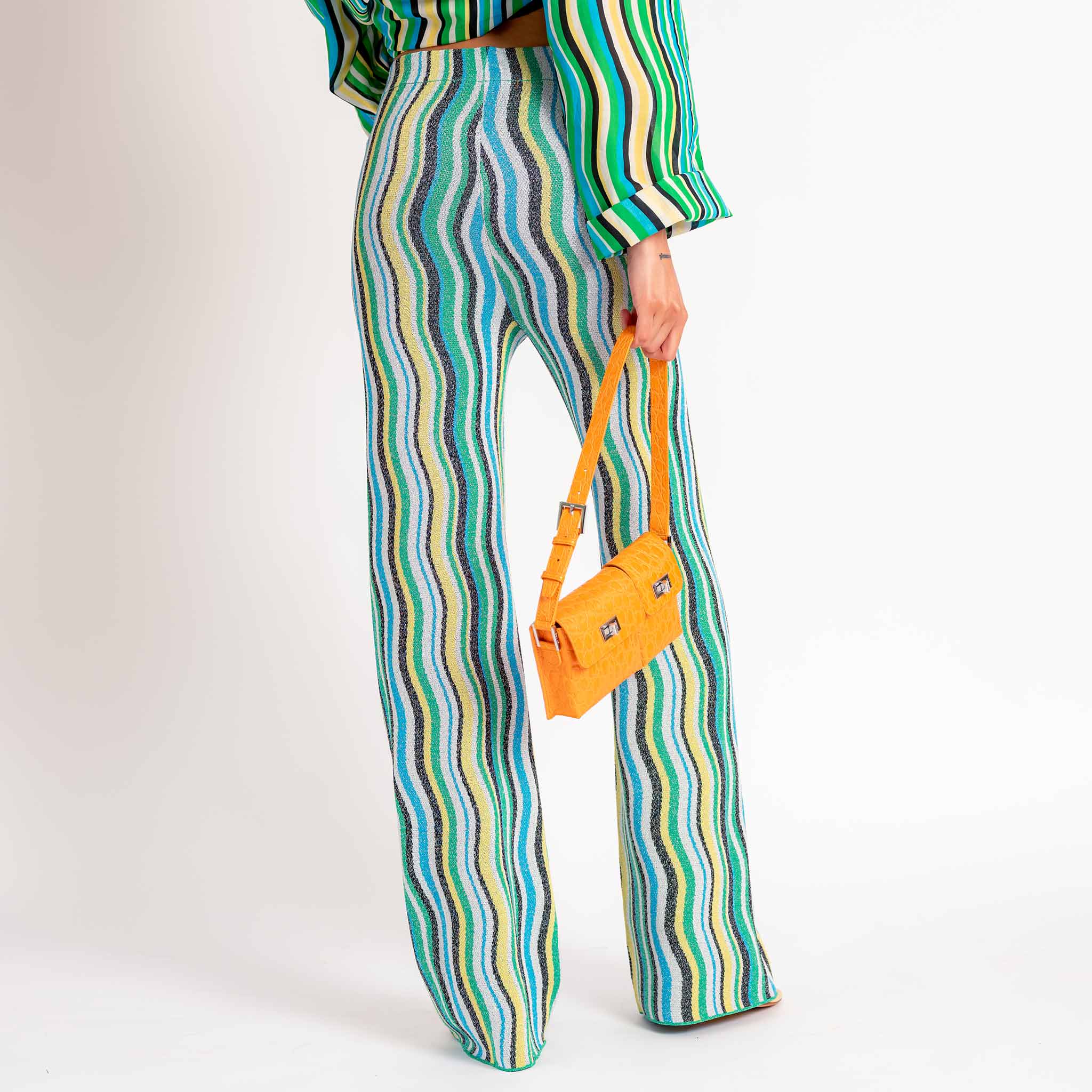 Back half body photo of model wearing the Nova Pant - Blue.