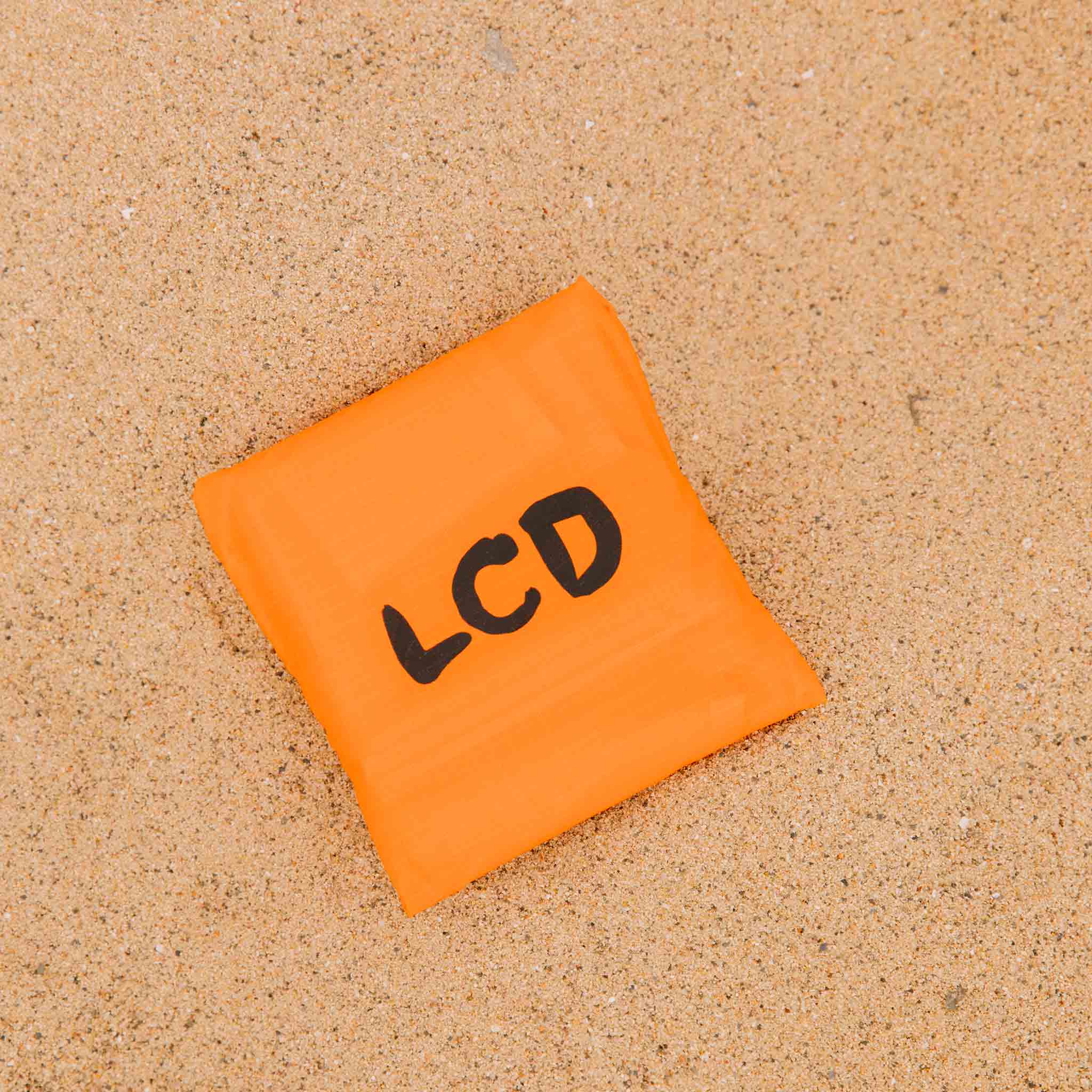 Close detail photo of the bag pouch for the LCD10 Reusable Graphic Tote - Orange.