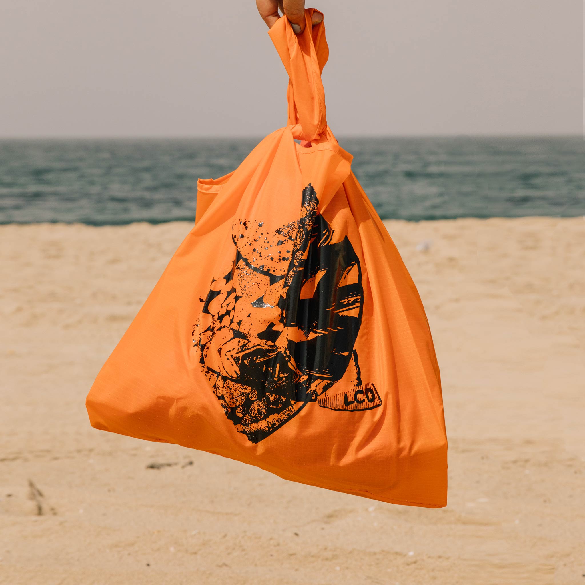 Close detail photo of the LCD10 Reusable Graphic Tote - Orange
