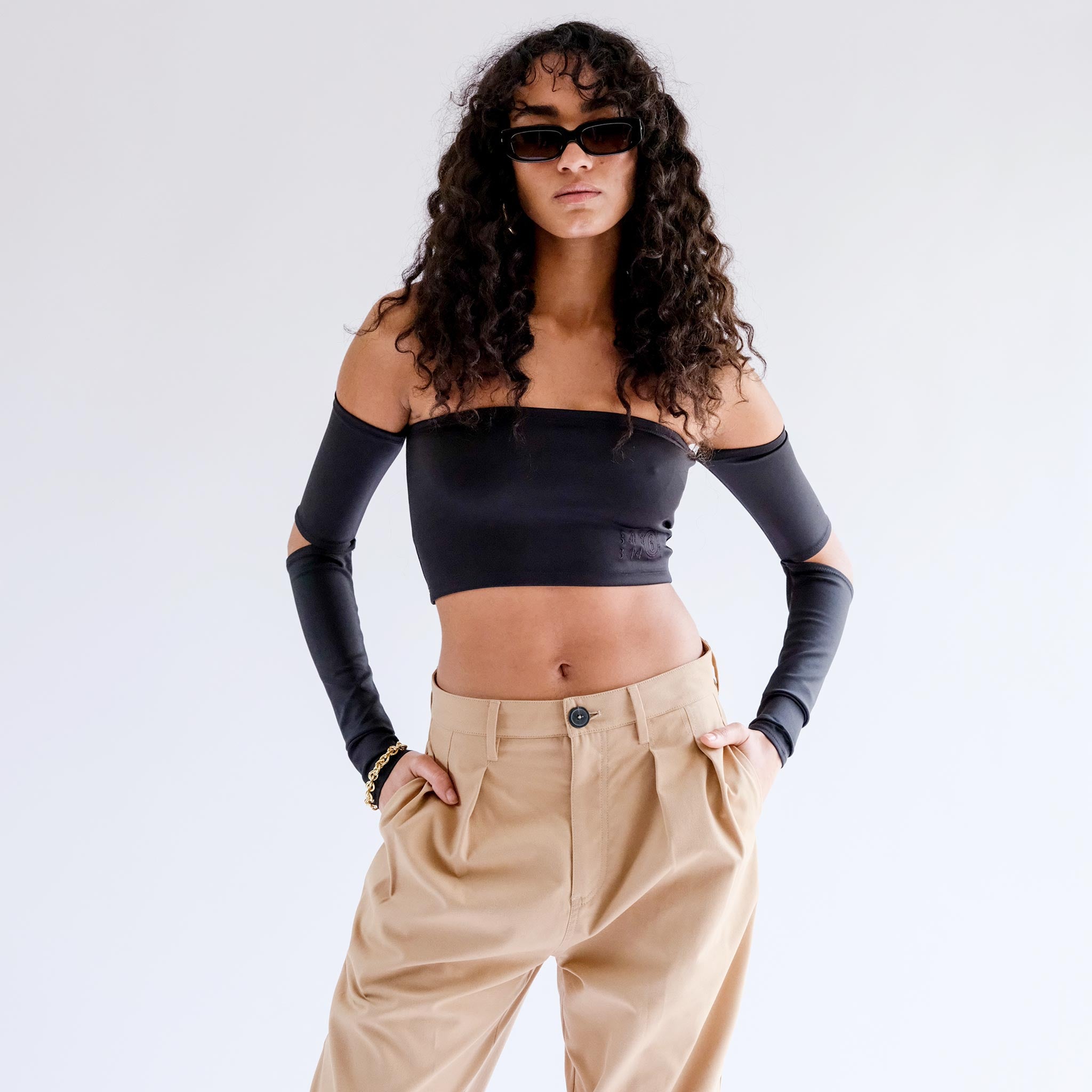 Front half body photo of model wearing the Off Shoulder Top with Sleeves - Black.