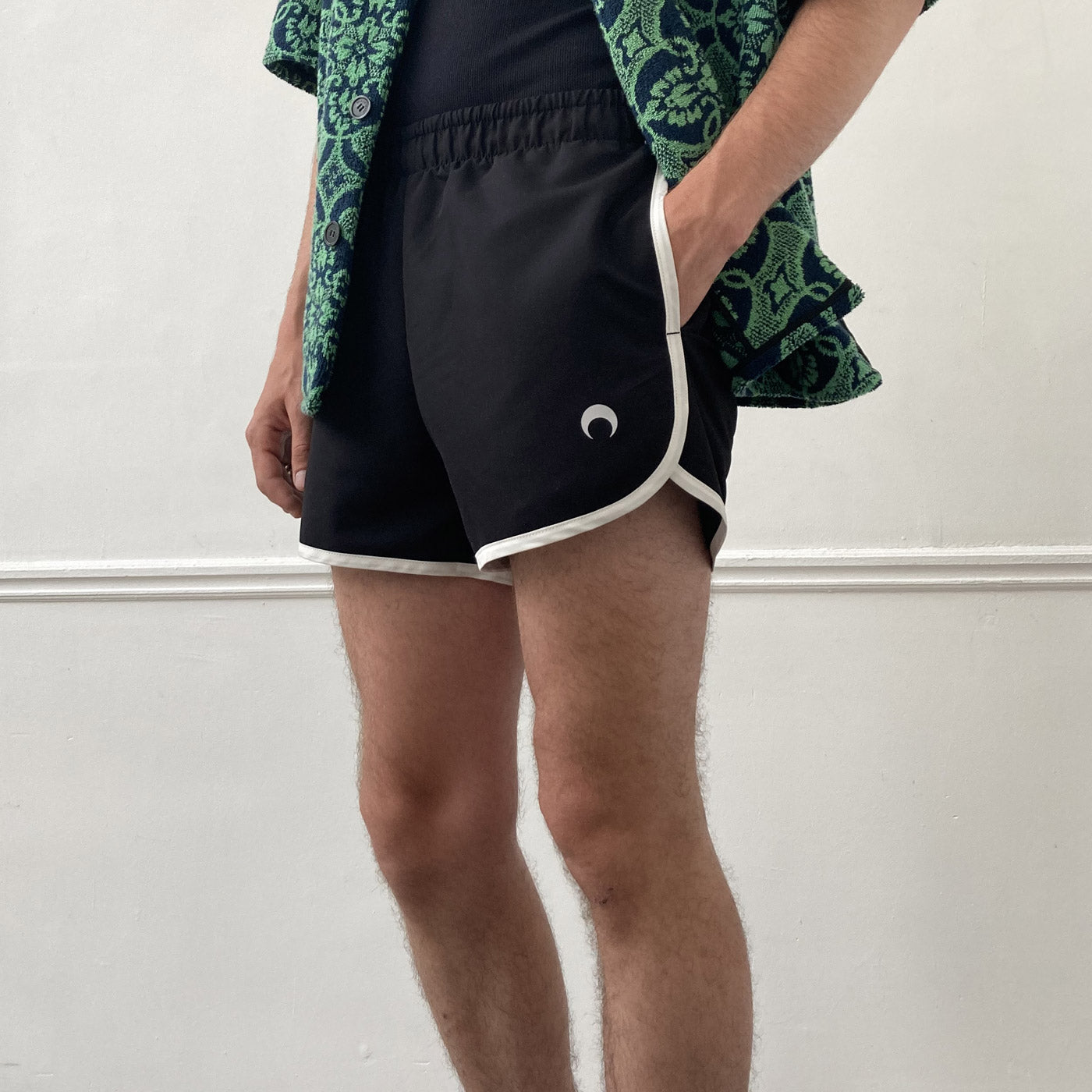 Vintage style running short in black with white piping and Marine Serre embroidered logo on front left thigh - showroom model.