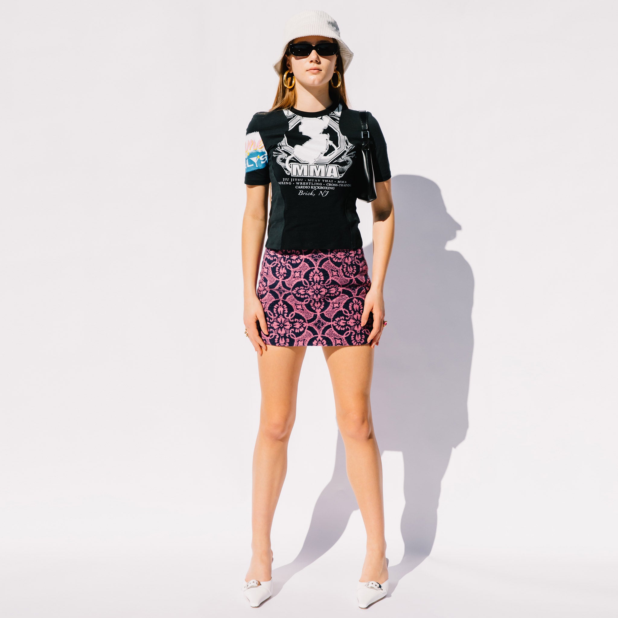 Full body photo of model wearing the Oriental Towels Mini Skirt - Fuchsia.