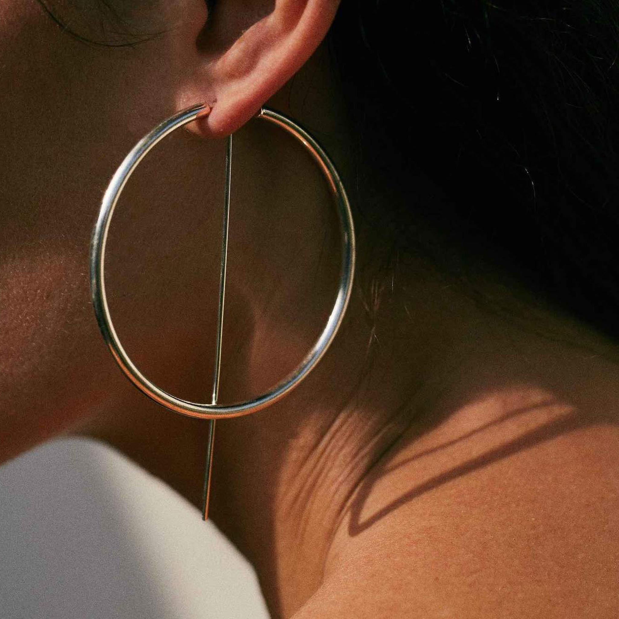 Jaclyn Moran - Oversized Hoop & Post Earrings in Yellow Gold, pictured on model.
