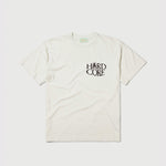 Flat photo of the white Palm SS Tee - Frost with chest print reading Hard Core.