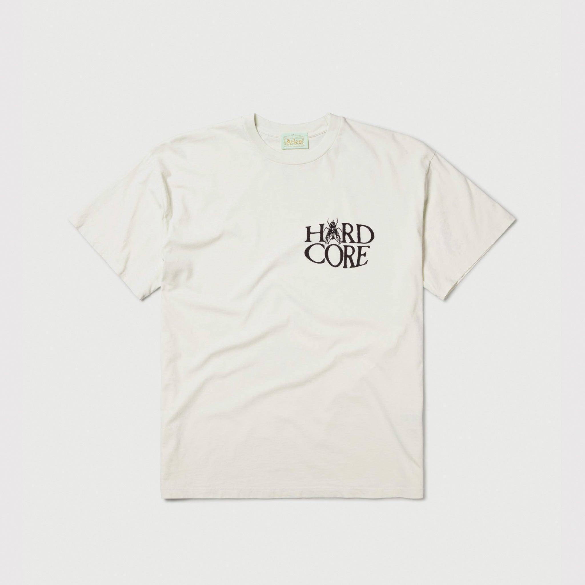 Flat photo of the white Palm SS Tee - Frost with chest print reading Hard Core.