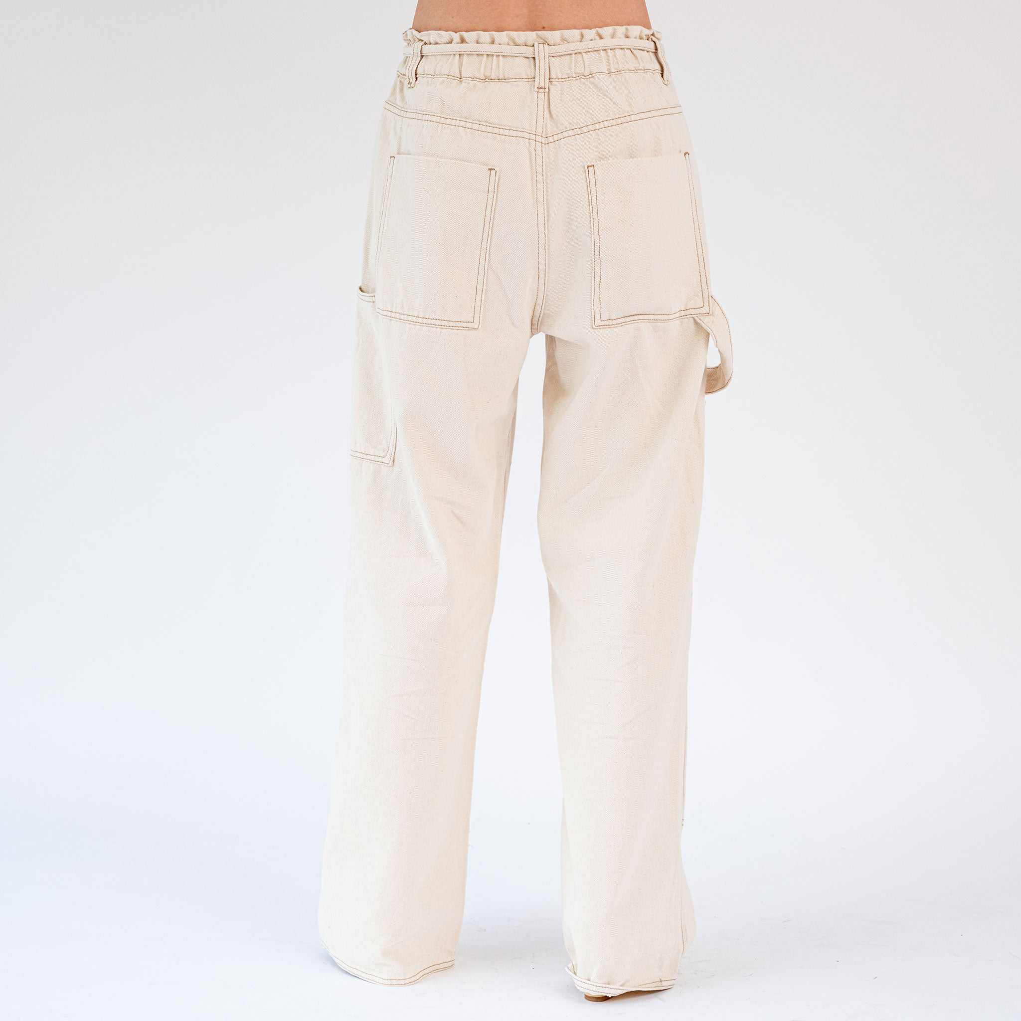 Back half body photo of model wearing the Paperbag Carpenter Pant - Natural. 