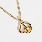 Close detail photo of the Peace Pendant Necklace.