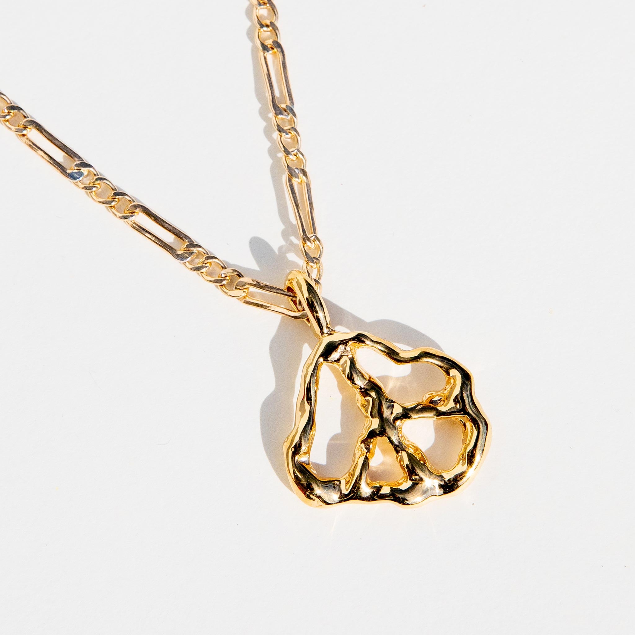 Close detail photo of the Peace Pendant Necklace.