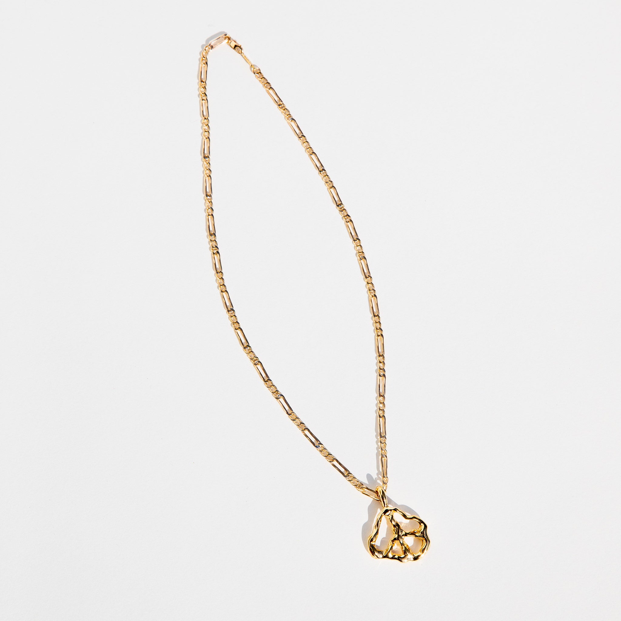 Flat photo of the Peace Pendant Necklace.