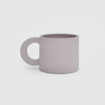 Flat image of the petal mug in lavender by Ekua Ceramics.