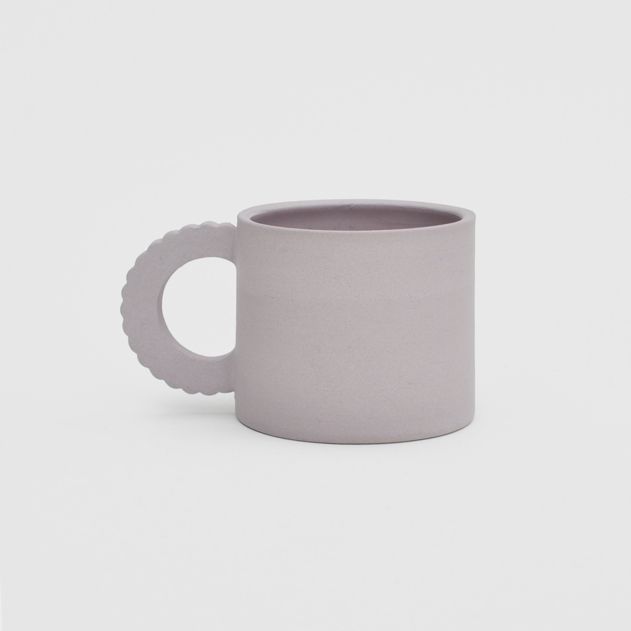 Flat image of the petal mug in lavender by Ekua Ceramics.