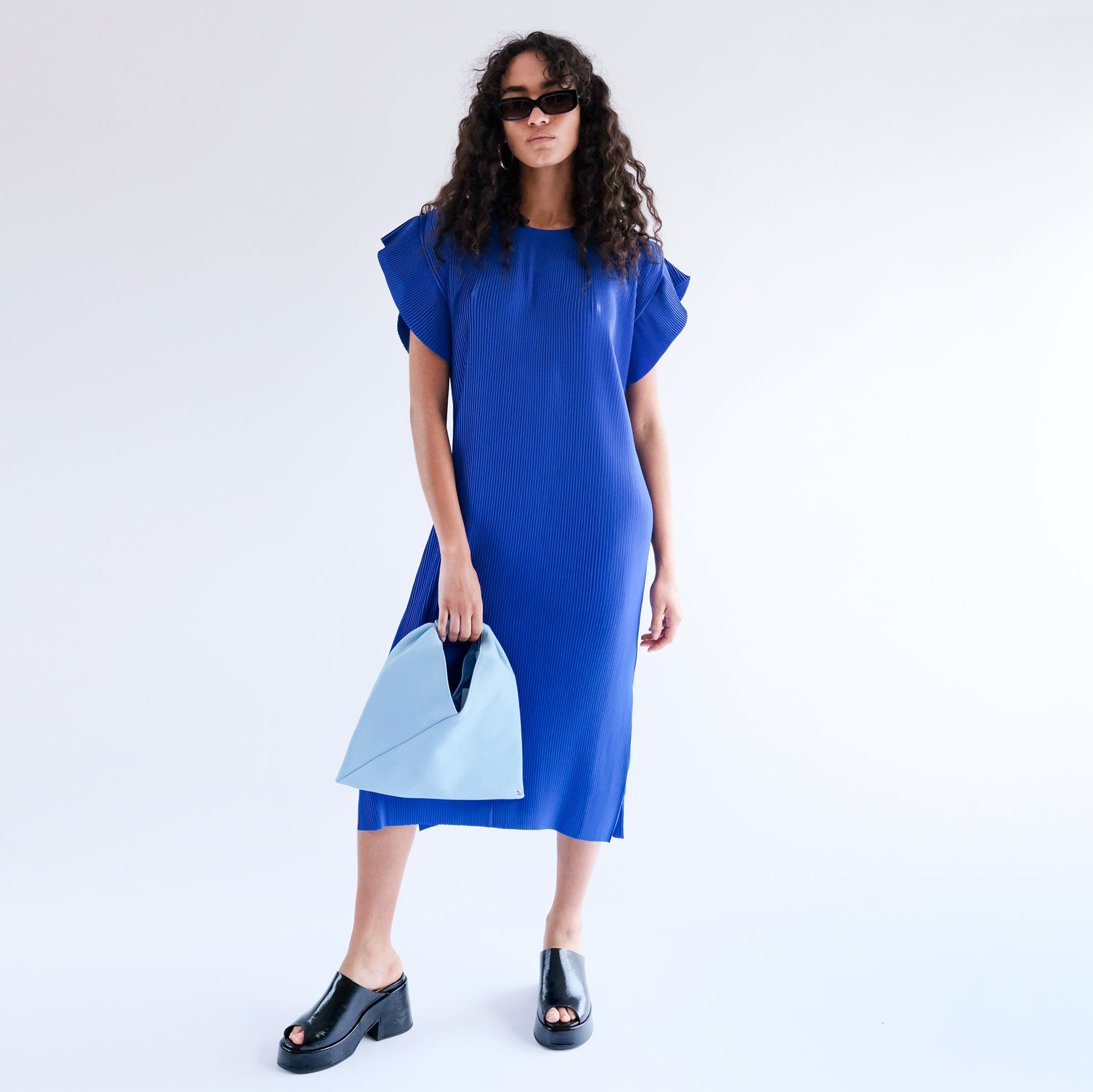 Full body photo of model wearing the Pina Plissé Dress - Navy.