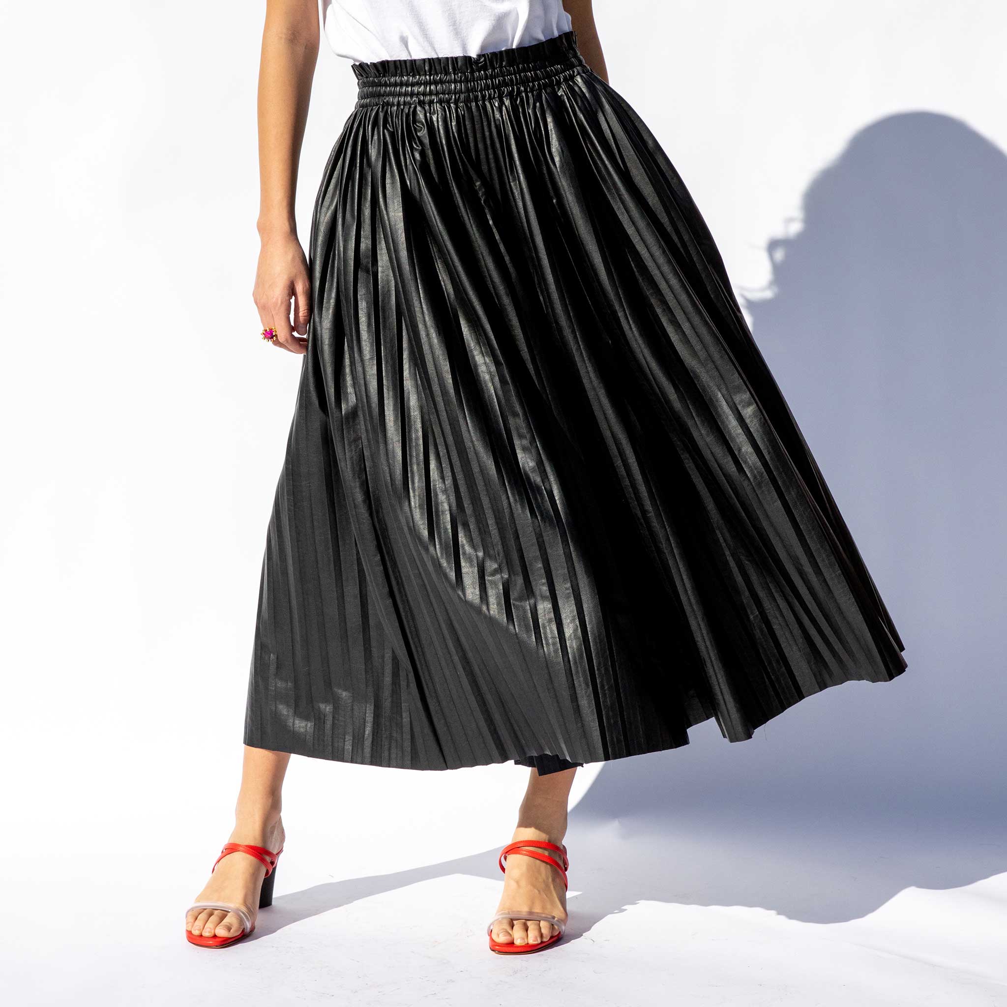Front half body photo of model wearing the Pleated Skirt / Pants.