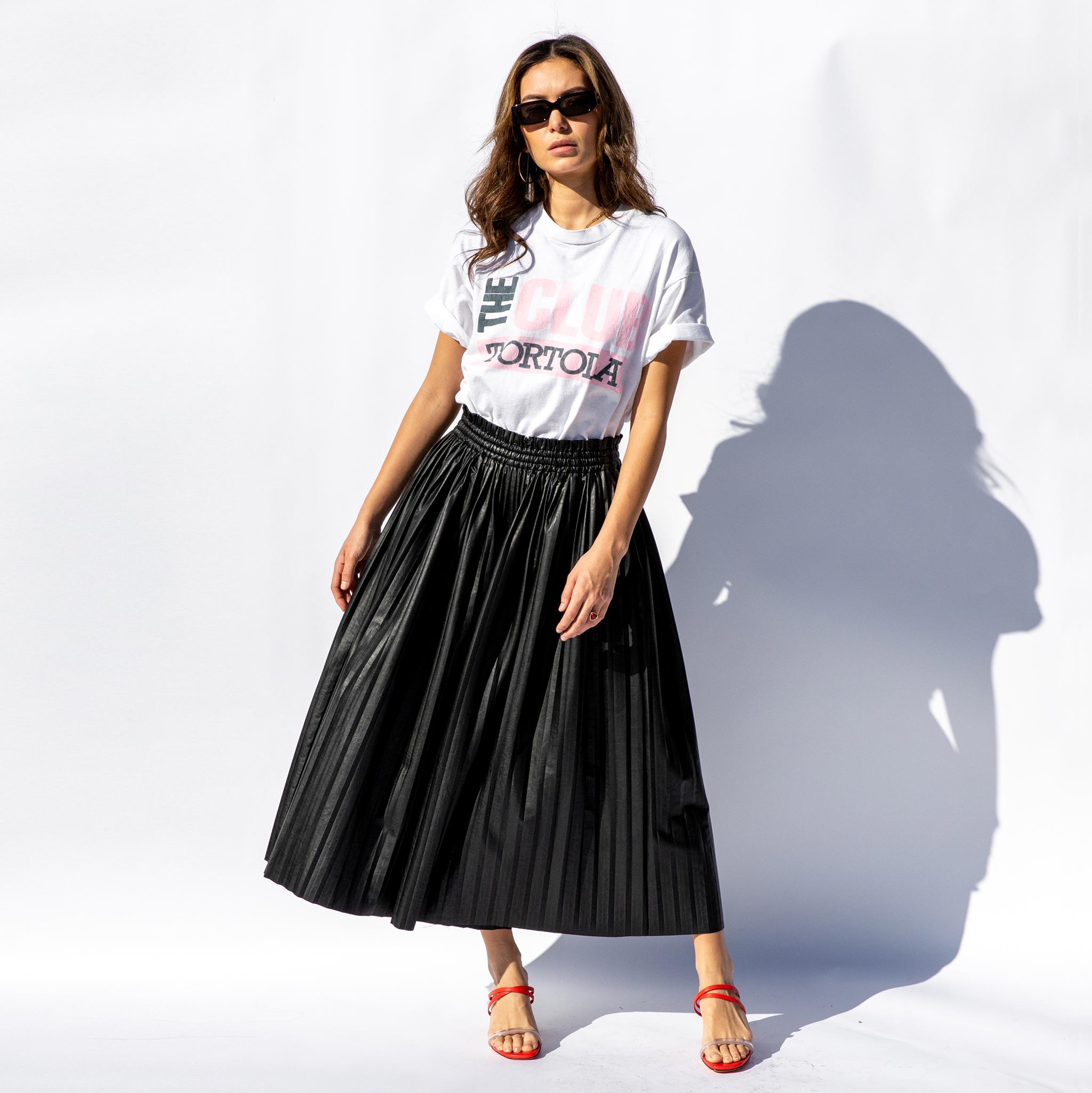 Full body photo of model wearing the Pleated Skirt / Pants.