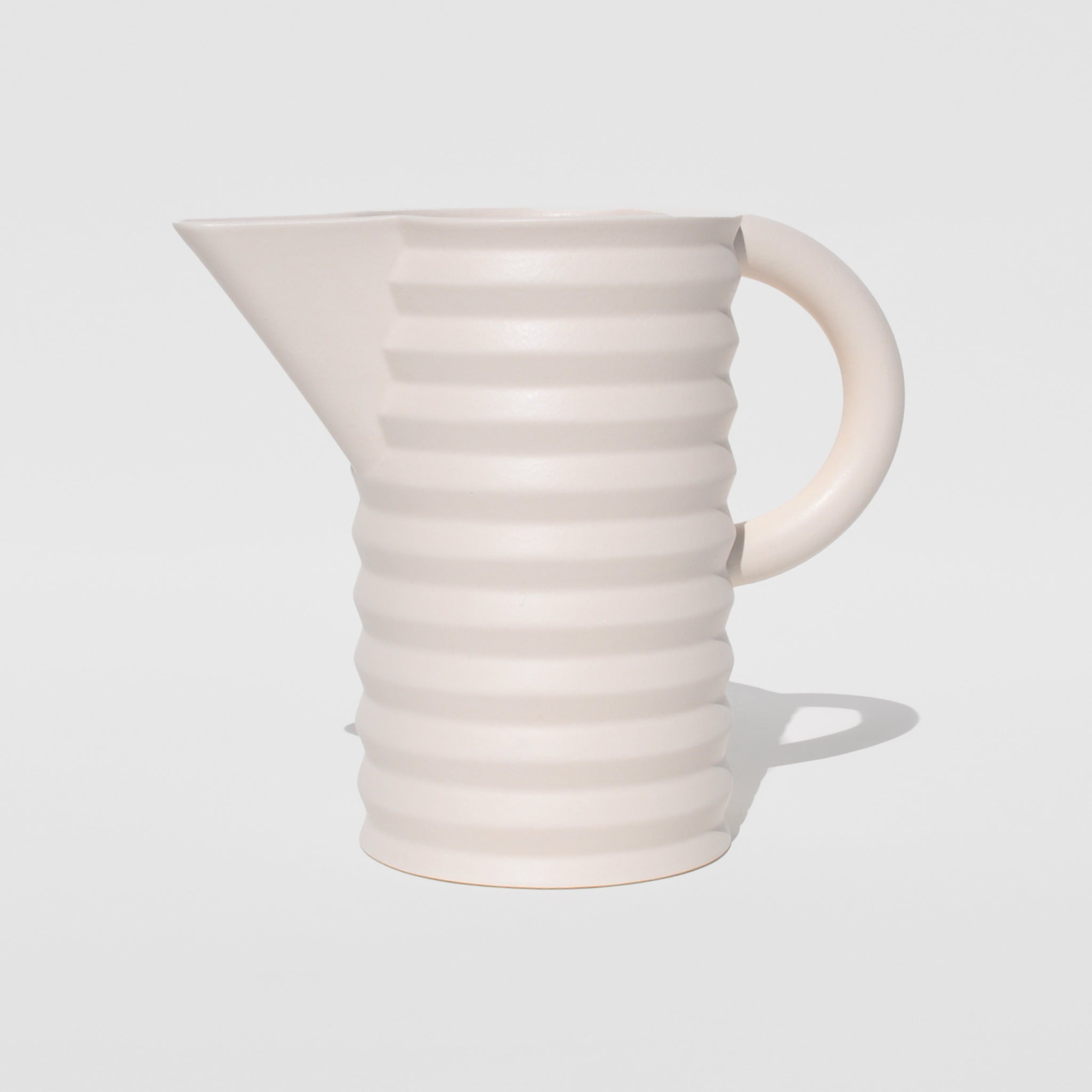 Flat image of the pleated pitcher in white by Areaware.