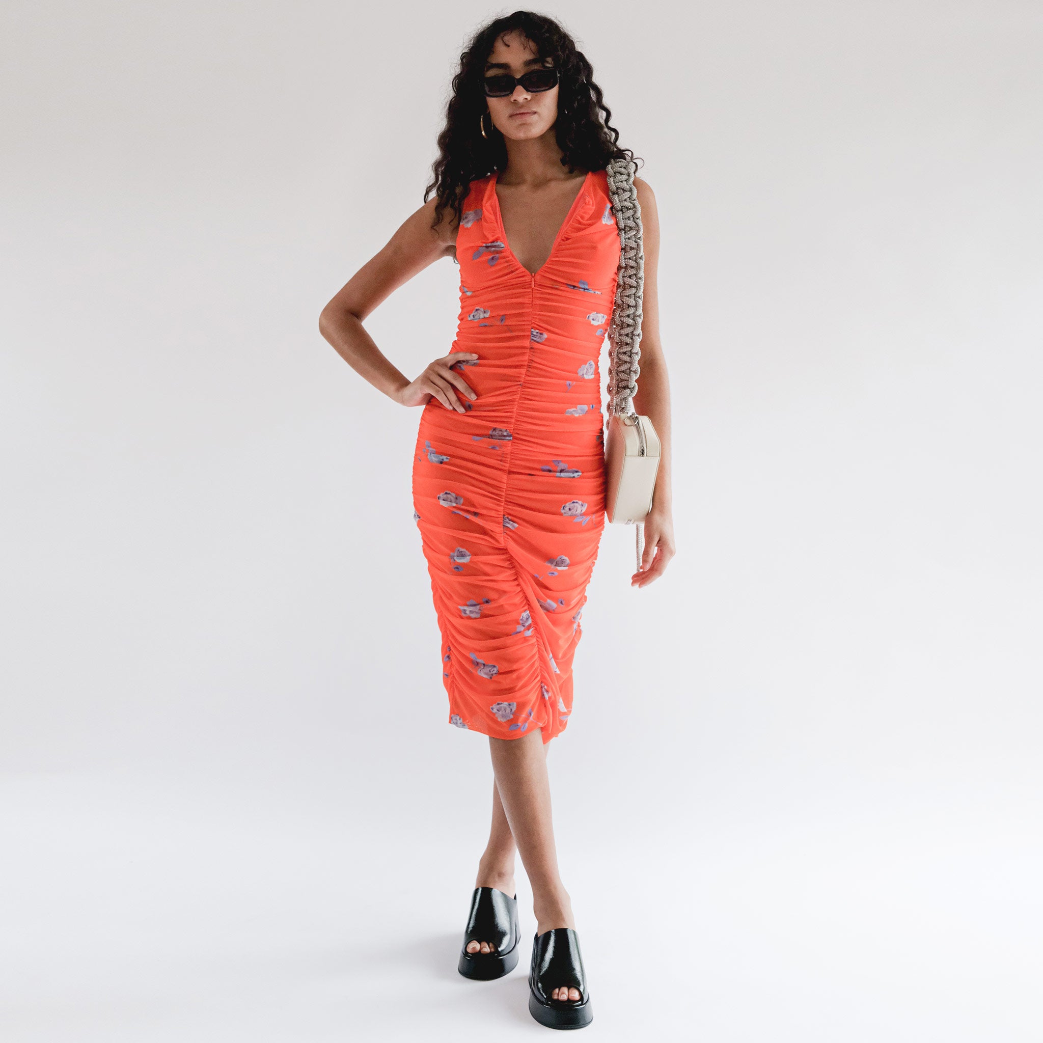 Full body photo of model wearing the Printed Mesh Ruched Sleeveless Midi Dress - Orangeade.
