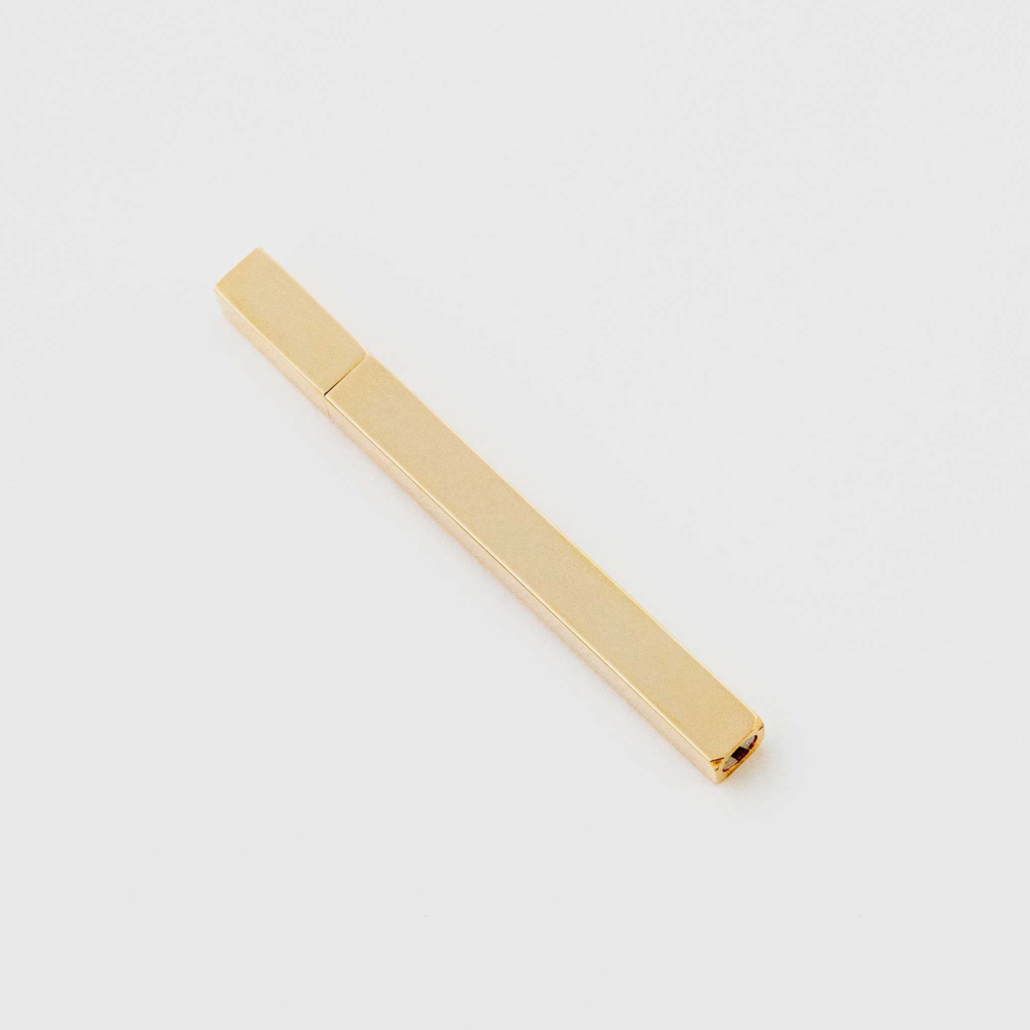 Tsubota Pearl - Gold Queue Stick Lighter with the cap on.