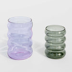 Close detail photo of the small ripple cup in smoke and a large ripple cup in lilac. 
