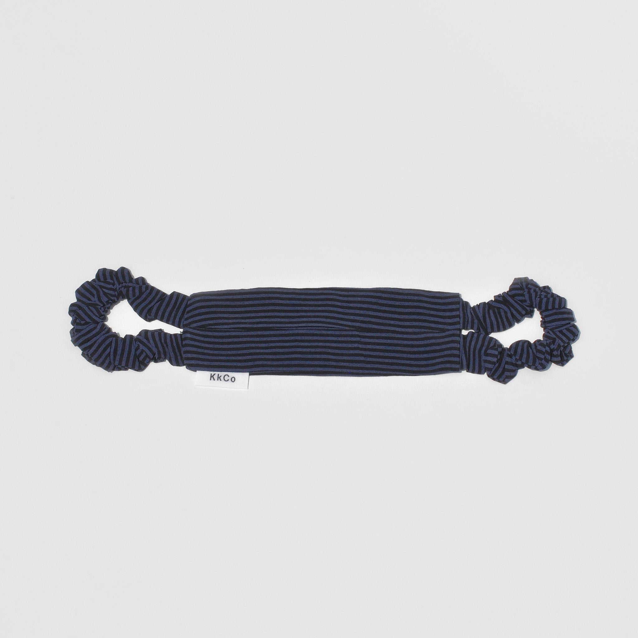 Flat image of a navy and black horizontally striped face covering featuring scrunchie style ear loops.