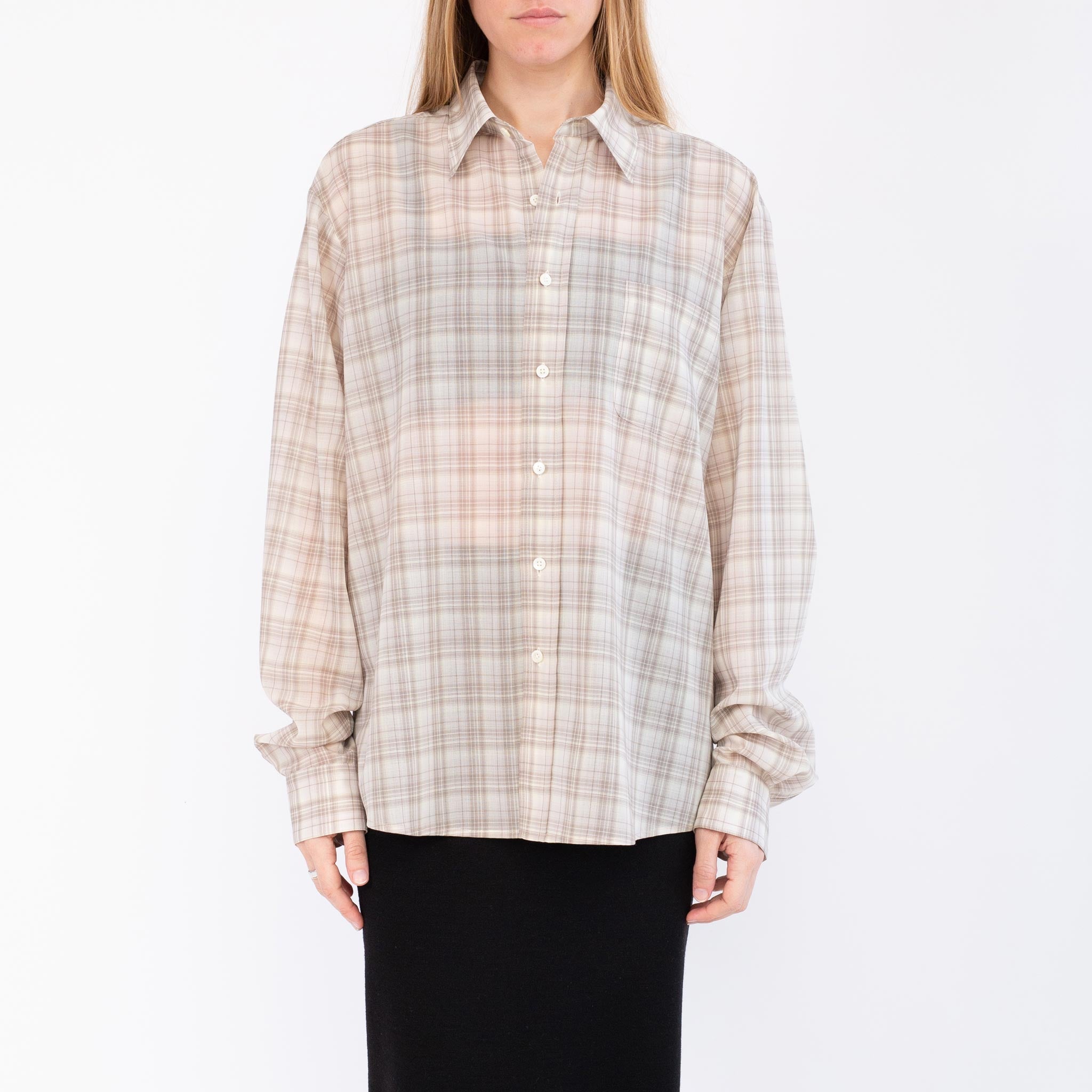 Close half body photo of model wearing the Sheer Foundation Button Down - Greige.
