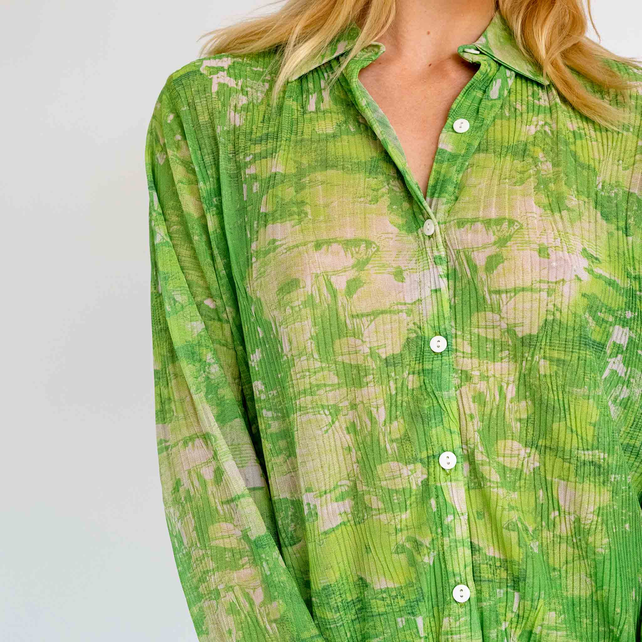Close detail photo of model wearing the Short Mesh Plisse Shirt - Green Riddle.