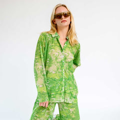 Close half body photo of model wearing the Short Mesh Plisse Shirt - Green Riddle. 