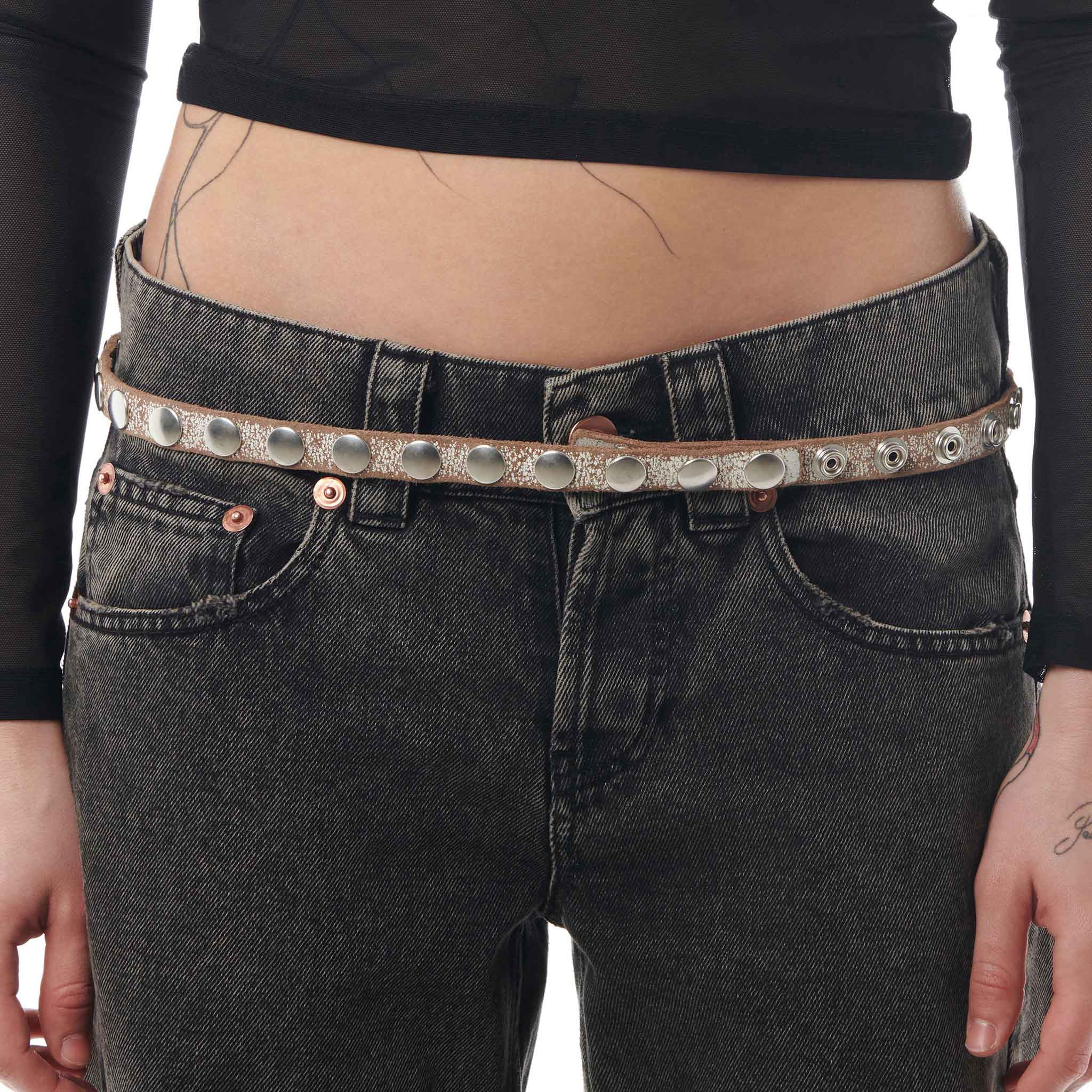 Close detail photo of model wearing the Snap Skinny Belt.