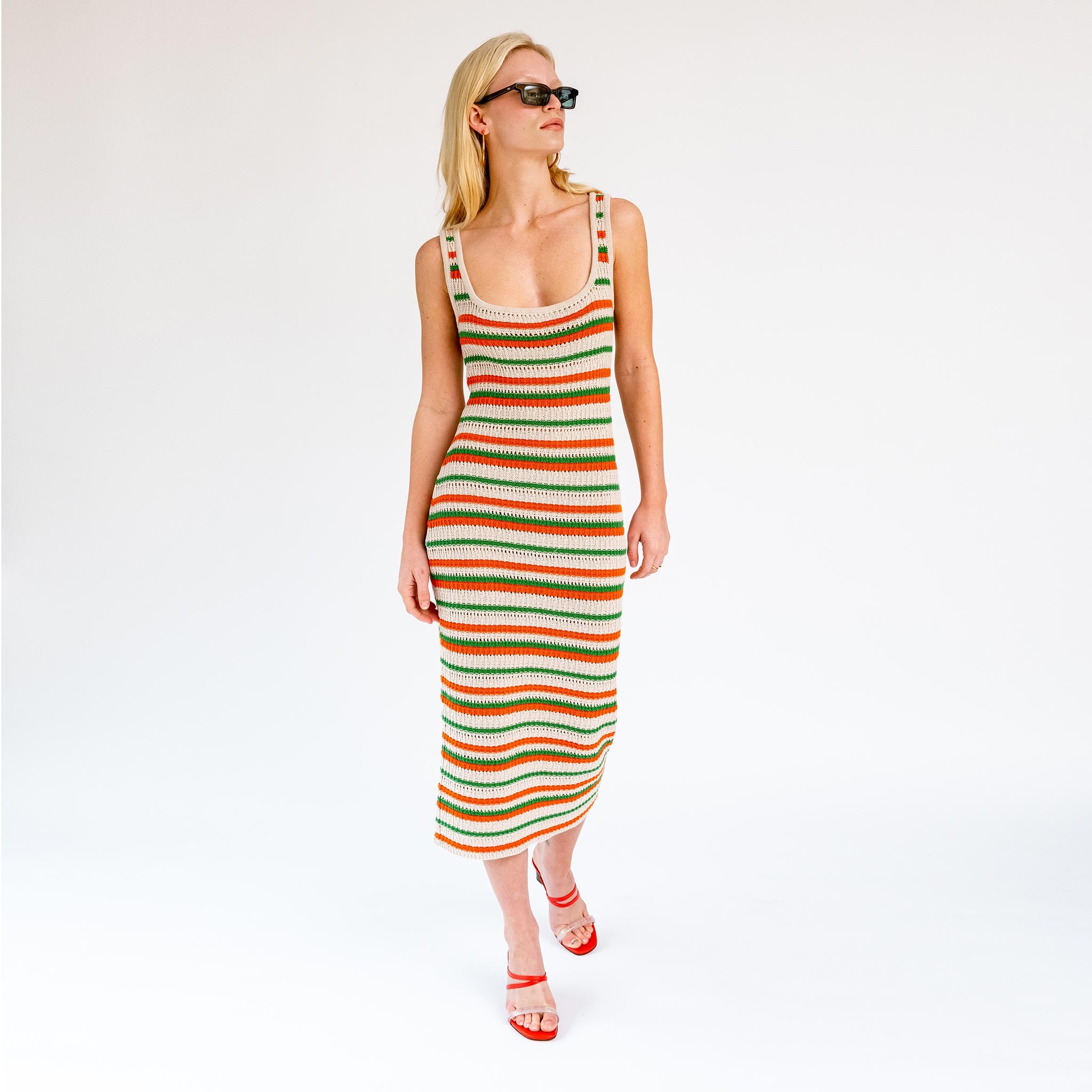 Full body photo of model wearing the Striped Knit Midi Dress - Green Orange