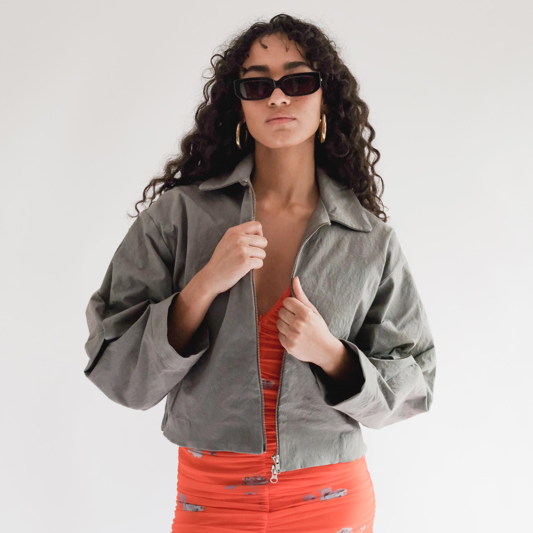 Close half body photo of model wearing the Structure Jacket - Steel.