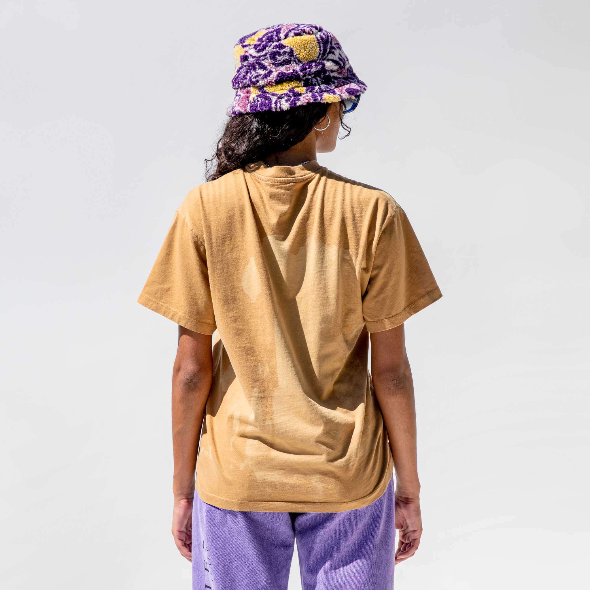 Half body photo of model wearing the Sunbleached Mega Temple Tee - Camel.