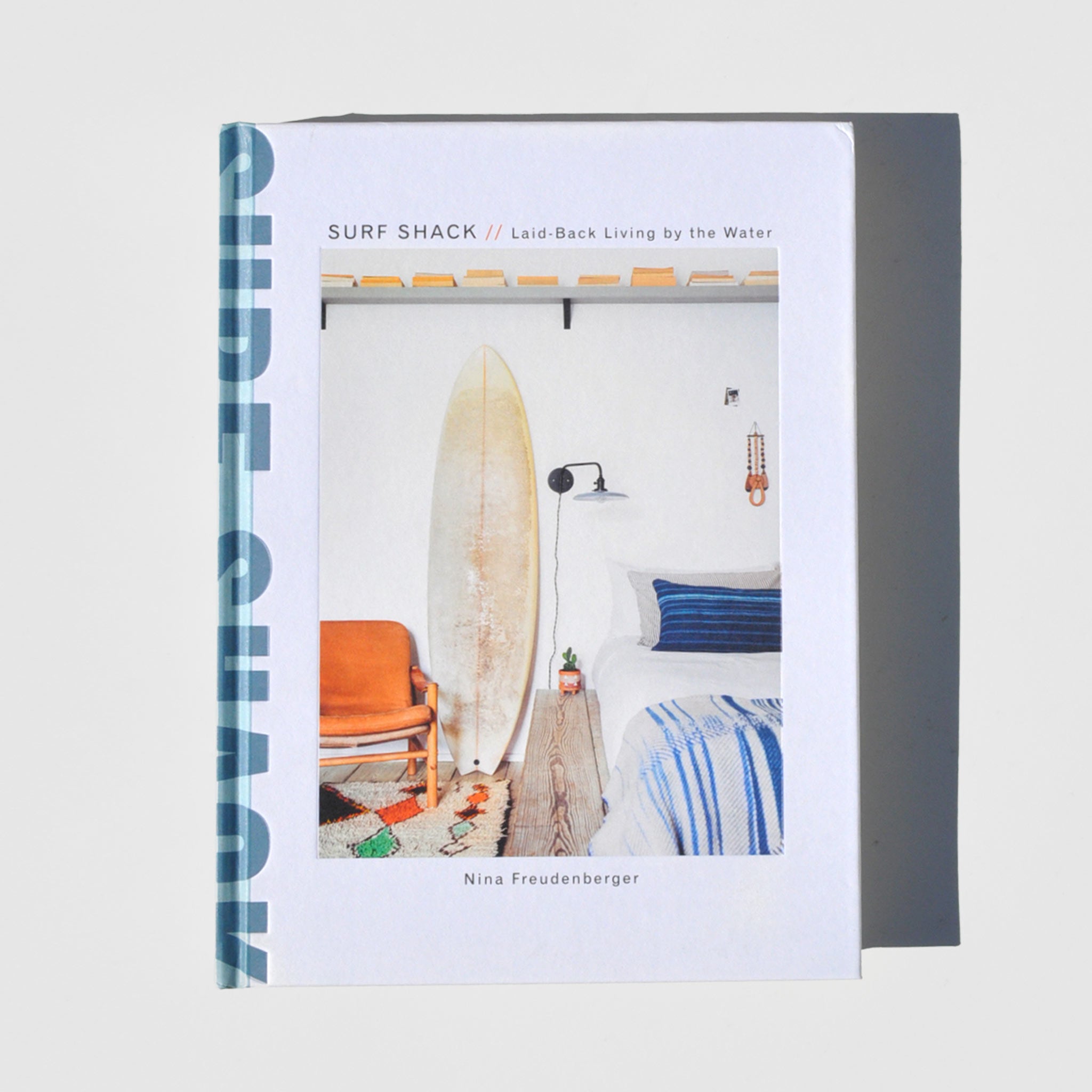 Flat image of surf shack laid back living by the water book.