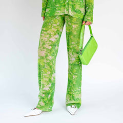 Front half body photo of model wearing the Sway Mesh Plisse Pants - Green Riddle.