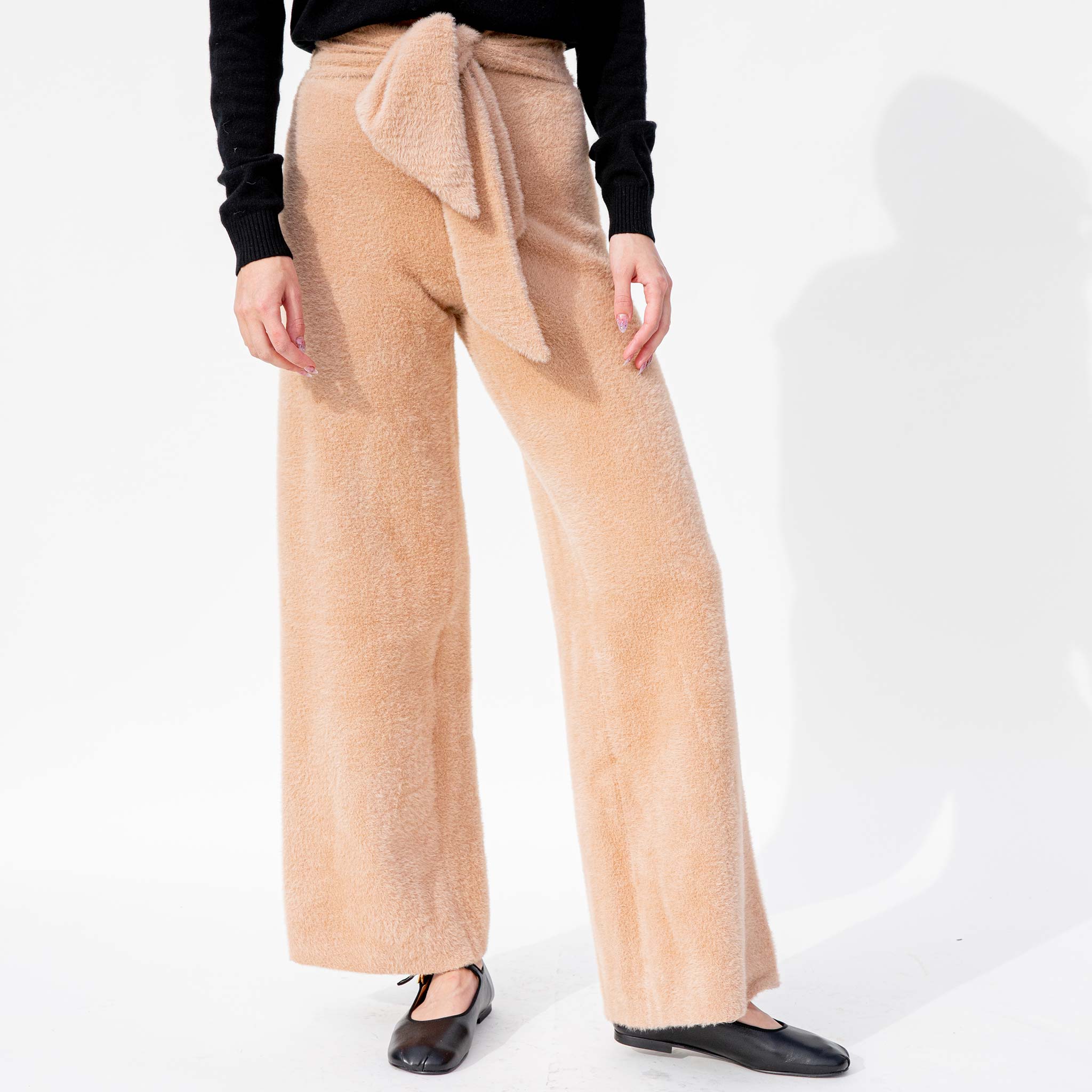 Front half body photo of model wearing the Tasi Pant - Milky Way.