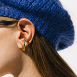 Close detail photo of model wearing the Triplet Earring - Gold Vermeil.