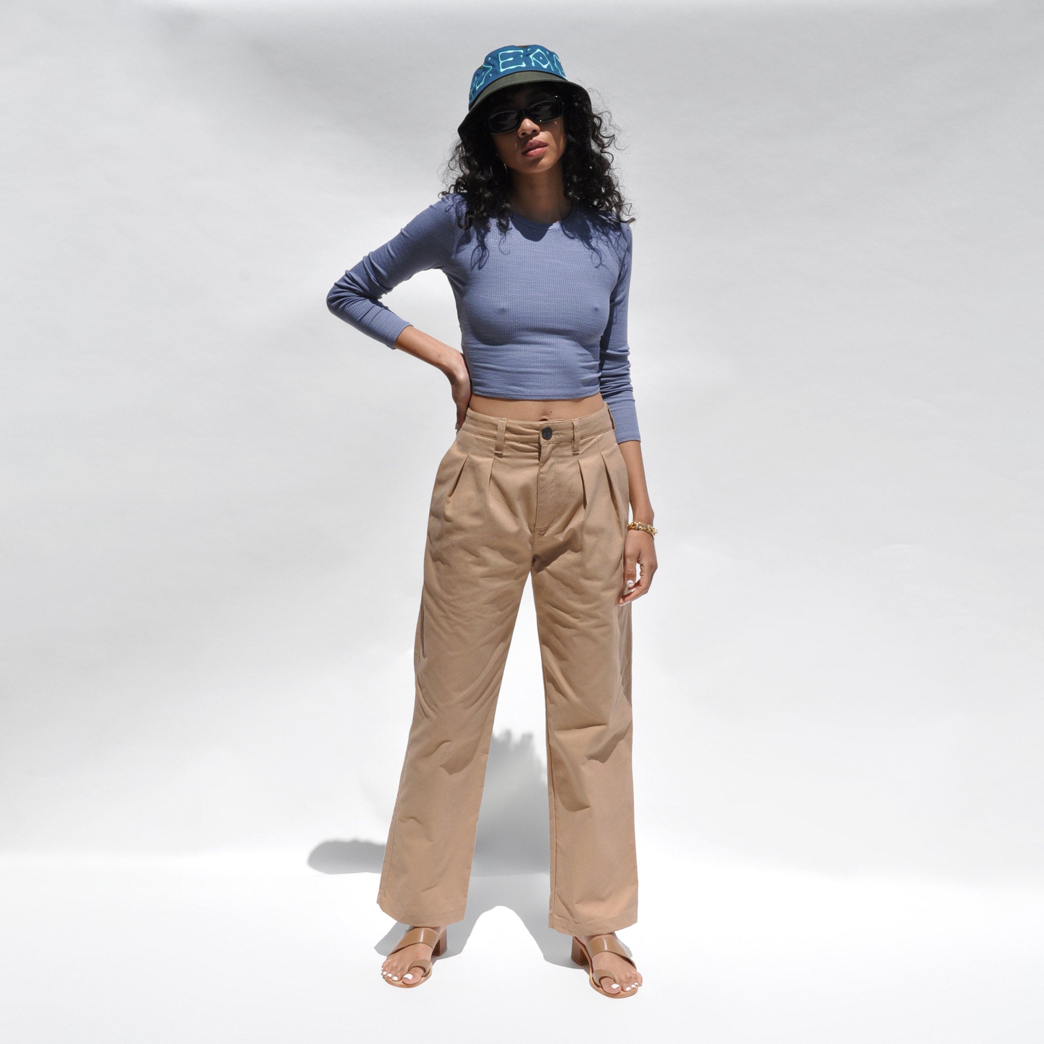Full body photo of model wearing the Twist Back Cropped Top in Slate Blue