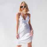 Front of the SVNR Vee Mini Slip dress as worn by a model.