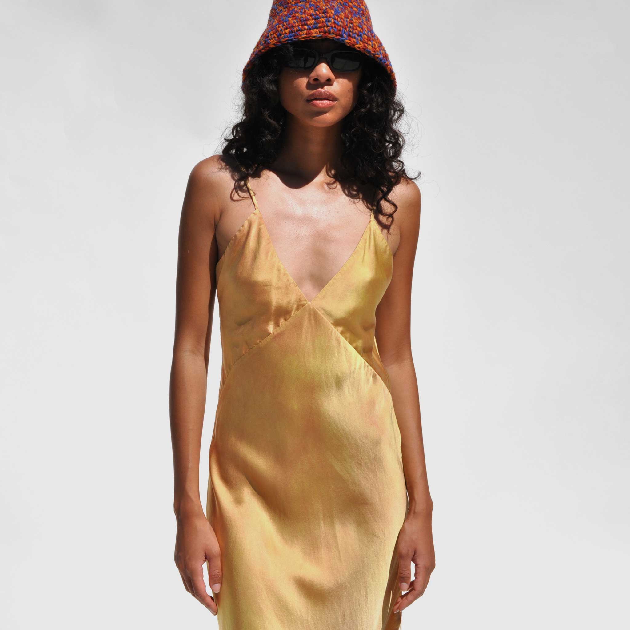 Front close detail photo of model wearing the Vee Midi Slip Dress - Nude