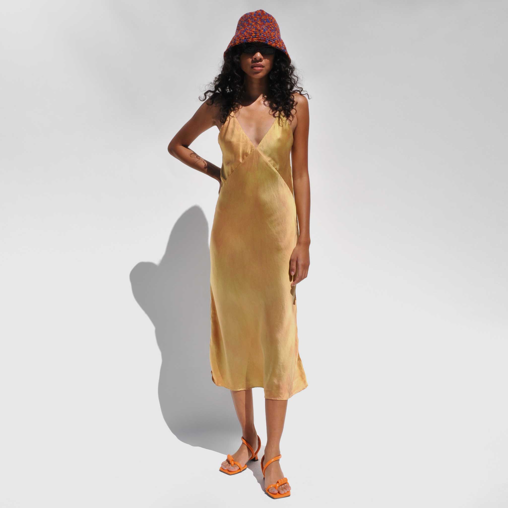 Full body photo of model wearing the Vee Midi Slip Dress - Nude