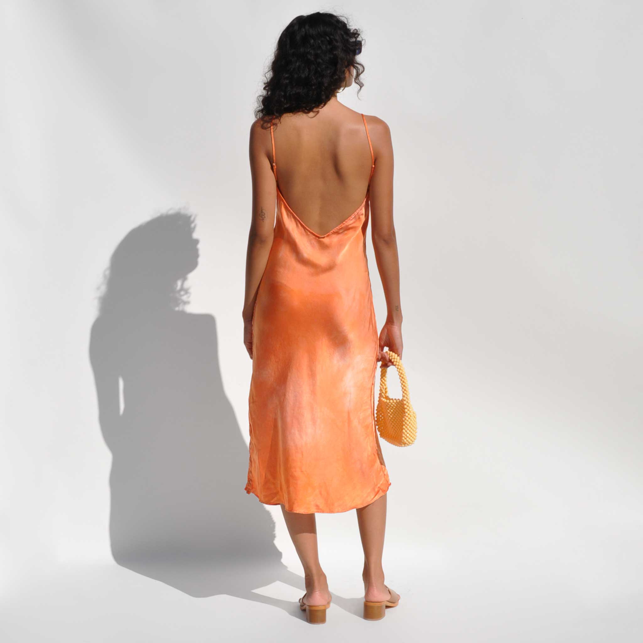 Front full body photo of model wearing the Vee Midi Slip Dress - Sunset