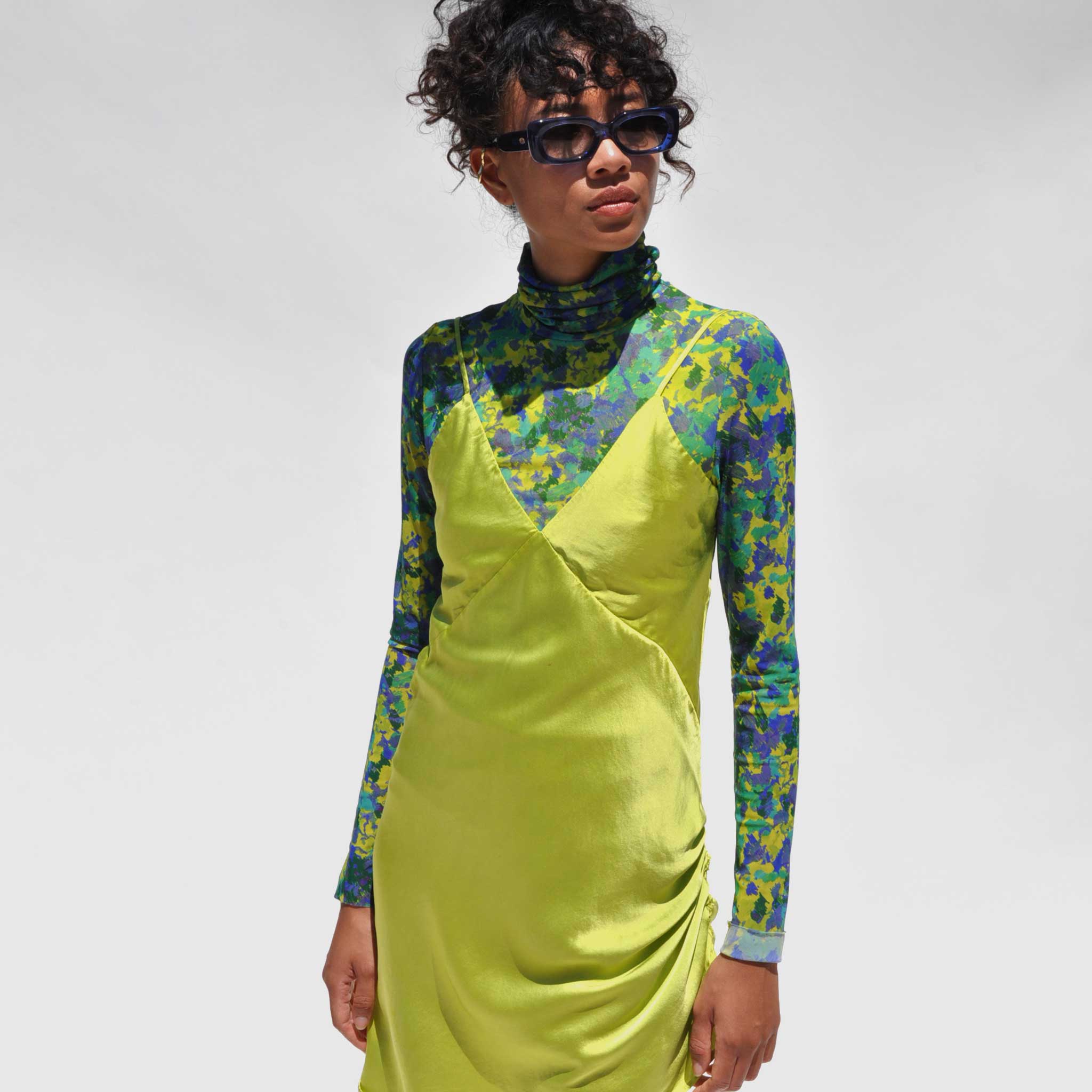 Front close detail photo of model wearing the Vee Mini Slip Dress - Grass