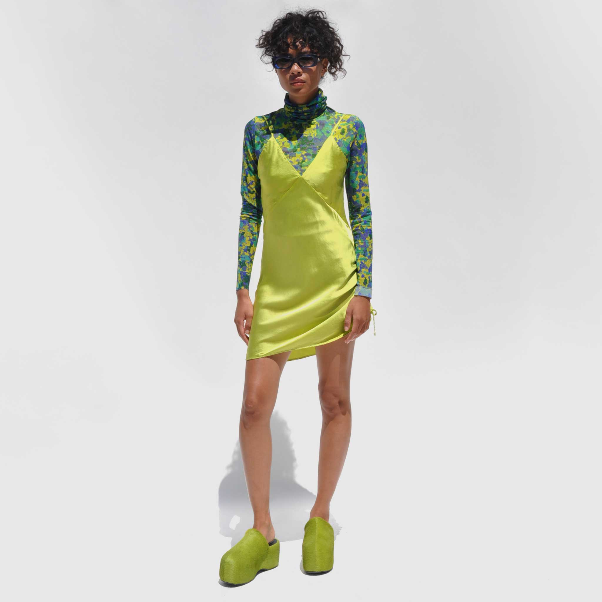 Photo of model wearing the Vee Mini Slip Dress - Grass