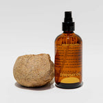Close detail photo of the everyday oil warm feelings 8oz bottle. t