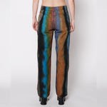Back half body photo of model wearing the Wide Leg Jean - Geode.
