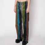 Close side half body photo of model wearing the Wide Leg Jean - Geode.
