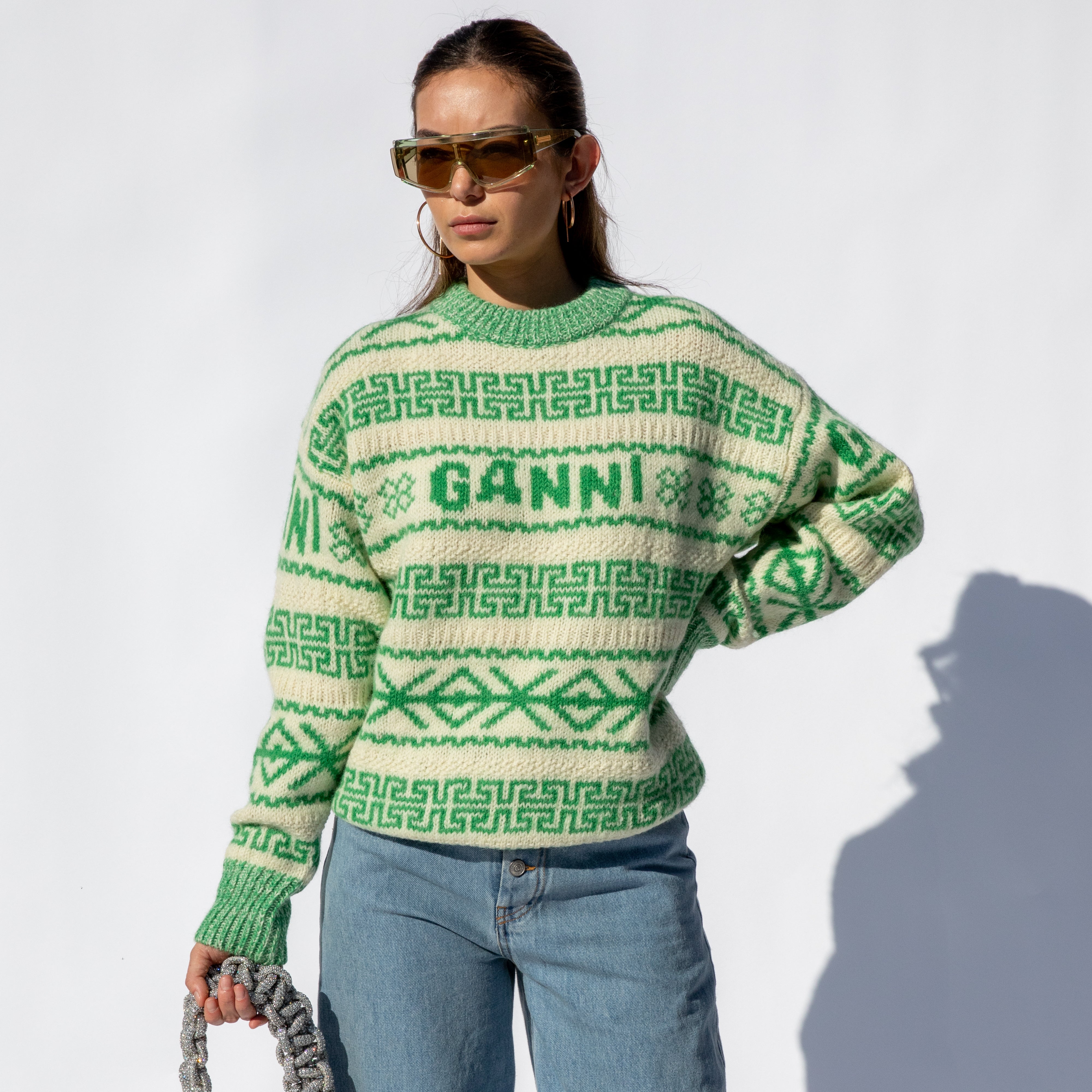 Close half body photo of model wearing the Winter Pullover - Egret.