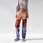 Miaou Atlas Pants featuring collaged landscape prints, front view as worn by a model.