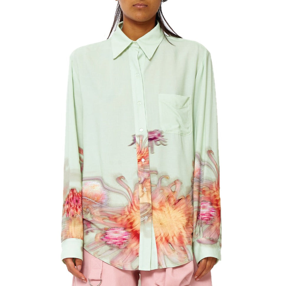 Front close half body photo of model wearing the Convention Button Up - Mint Chrysanthemum.